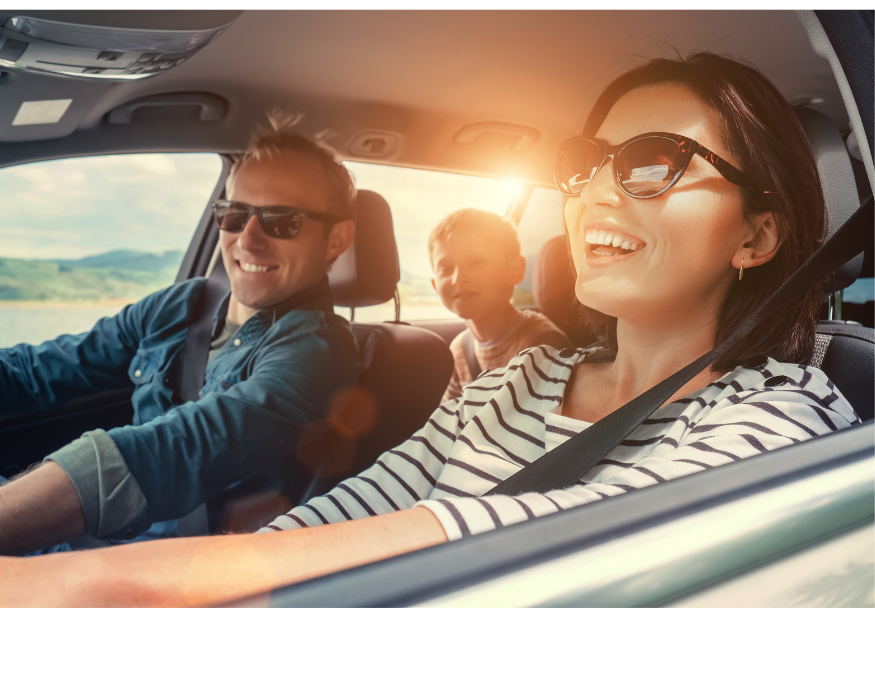 family enjoying a drive in a car